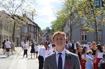 A person in a suit and tie AI-generated content may be incorrect.